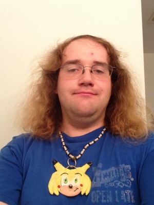 Chris with medallion - July 2014.jpg